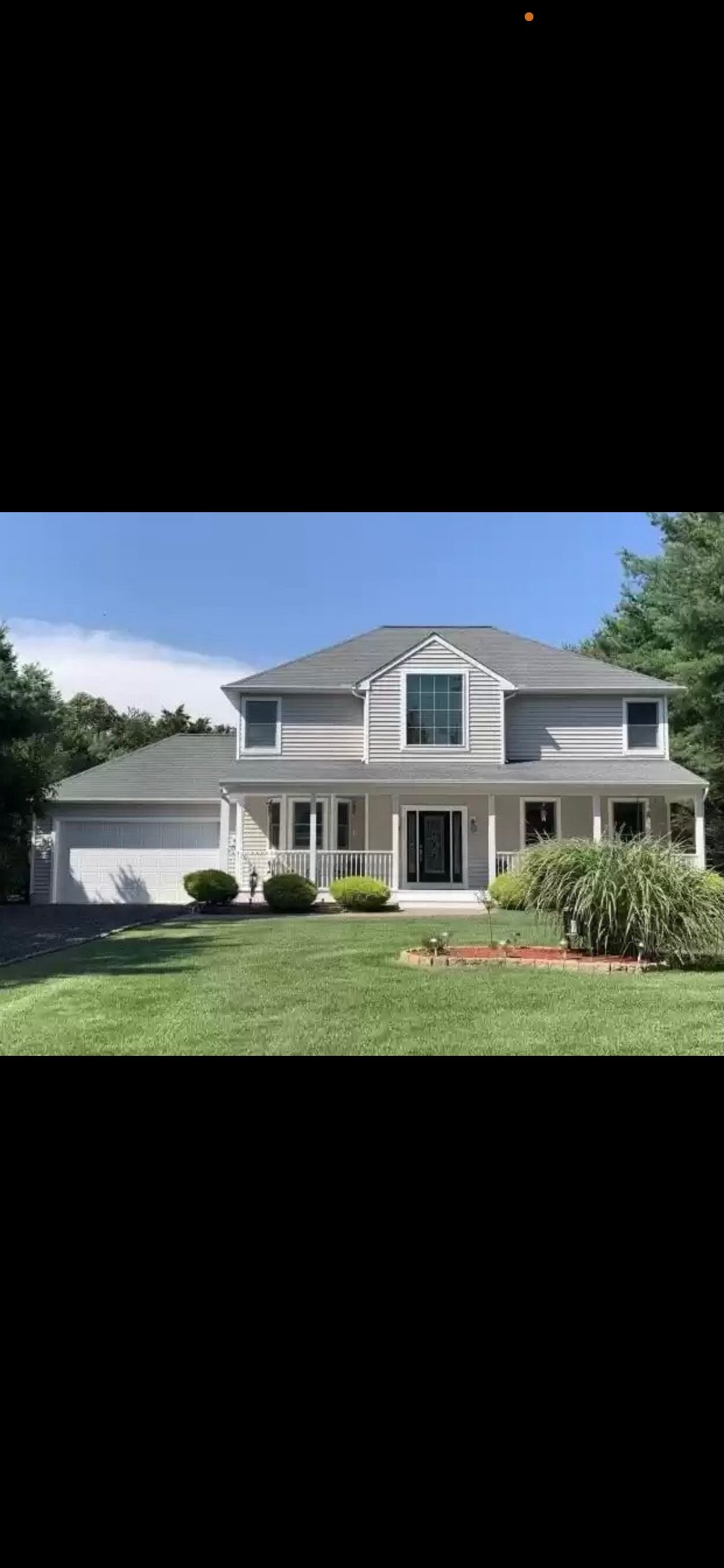 Before and After New Siding and Painted Black Garage Door. — photo 1