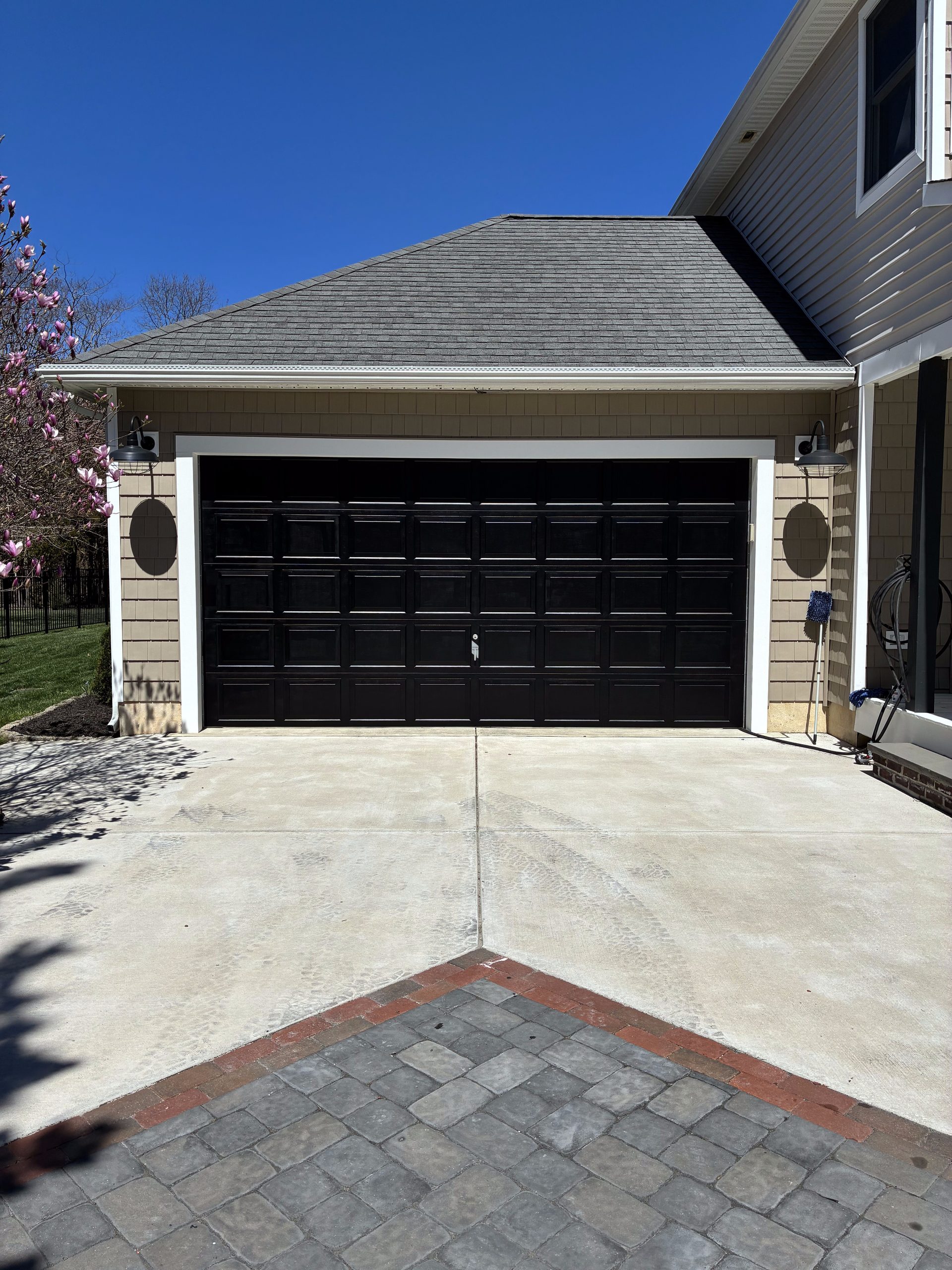 Before and After New Siding and Painted Black Garage Door. — photo 3