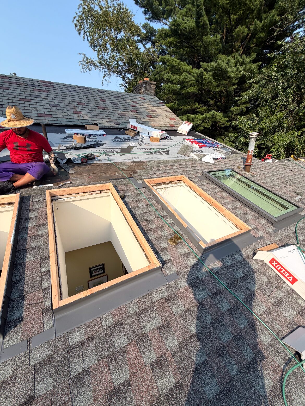 New skylight openings framed and VELUX units going in — Be Shore Exteriors