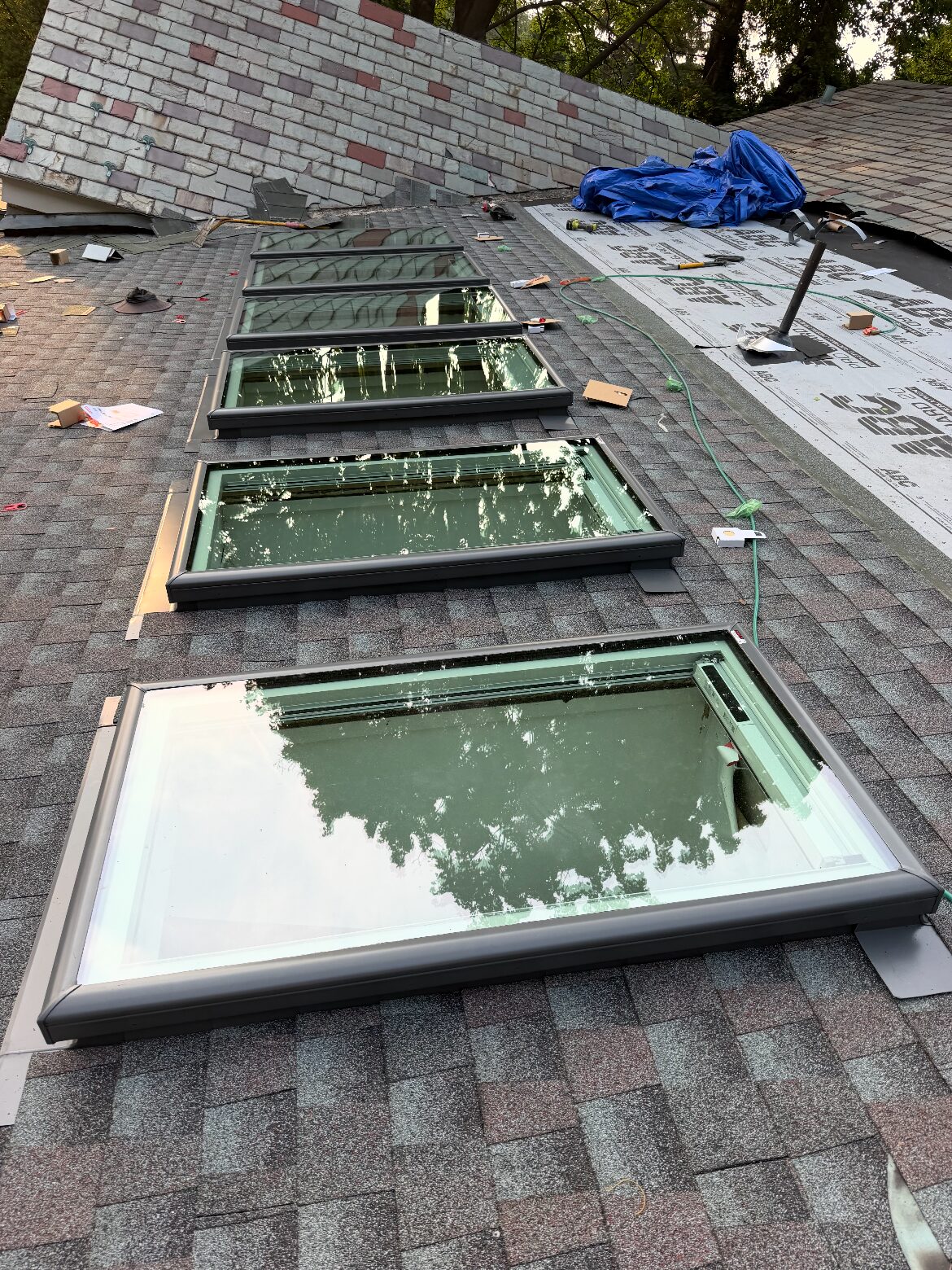 New VELUX skylights installed in a fresh shingle roof — Be Shore Exteriors