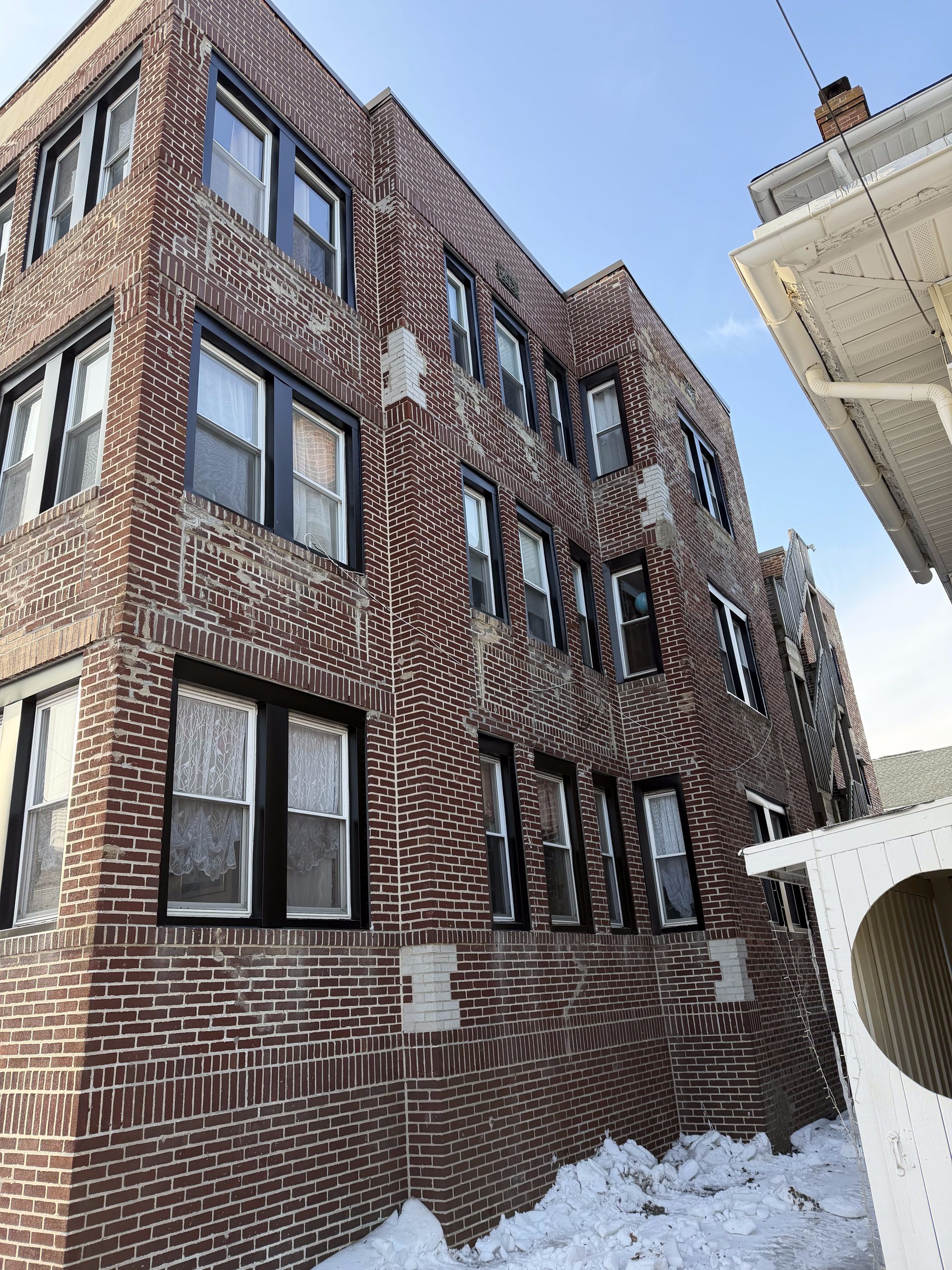 Black aluminum capping window install — Be Shore Exteriors
